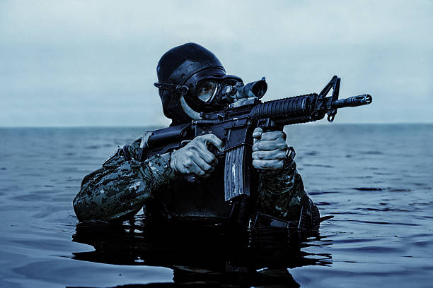 Navy SEALs training in the Pacific Ocean, preparing for submarine missions.